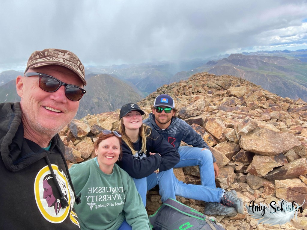 At the summit of Sunshine Peak after climbing 14ers