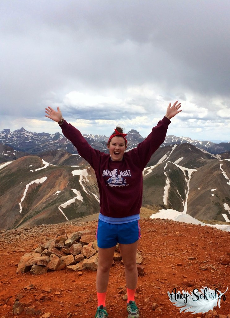 Rebecca celebrates the climb